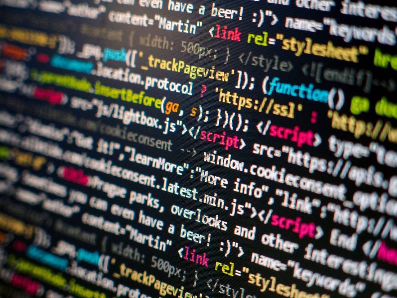 Colourful HTML and JavaScript source code on a computer screen