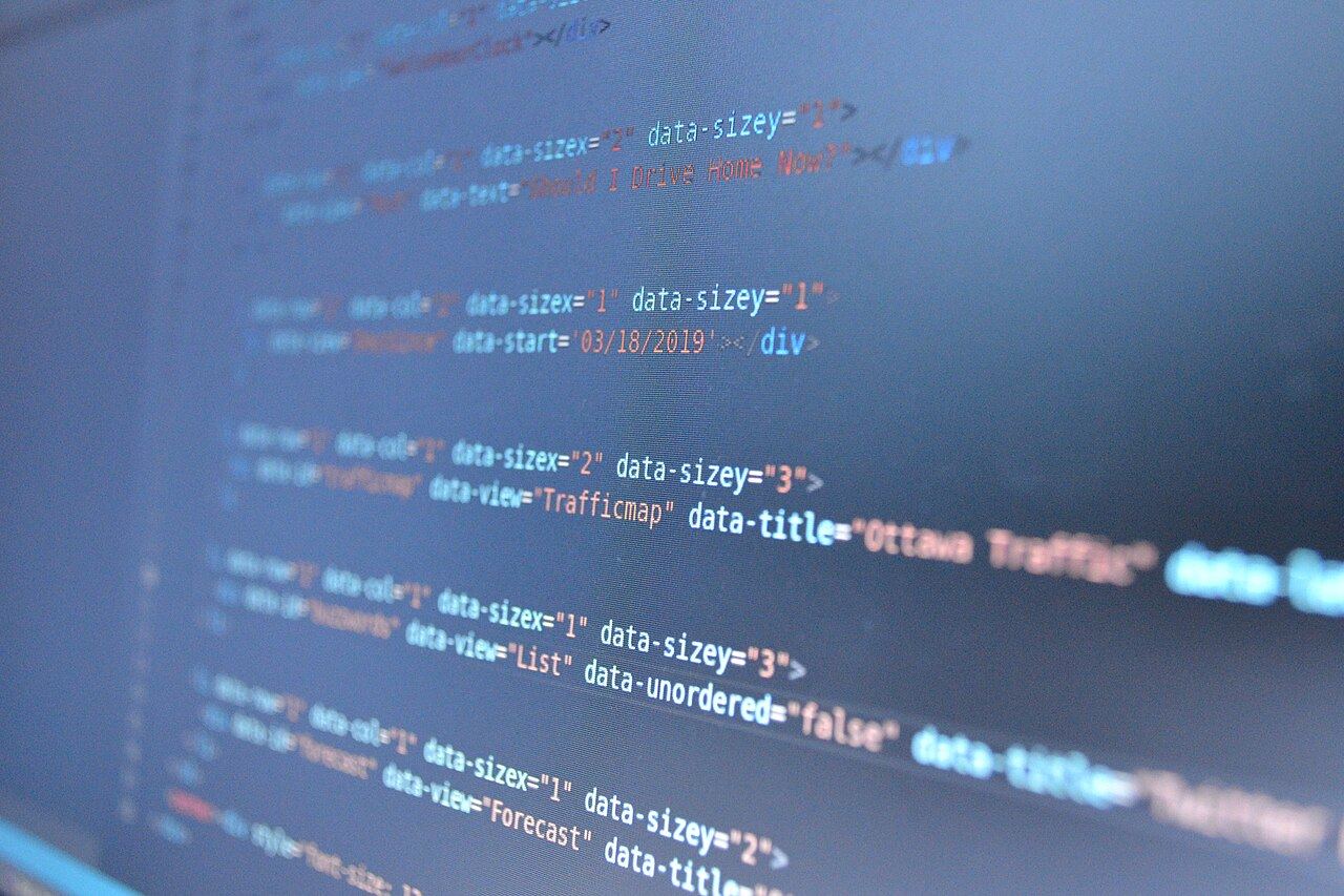 Blue lines of code on a monitor, slightly out of focus