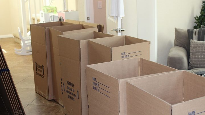 Stacked cardboard boxes ready for shipping in a room